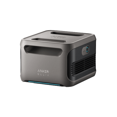 The Anker SOLIX BP3800 is a compact, gray device with a minimalist design featuring an 840Wh LFP battery. It includes a top handle, side ventilation, and a lens on one side, with the brand name Anker prominently displayed on the front.