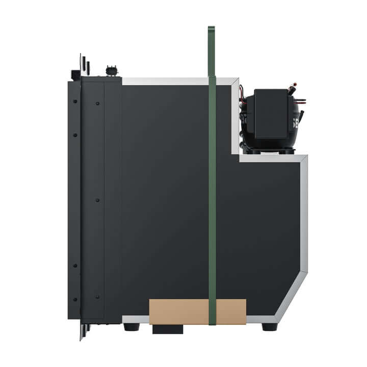 A side view of a dark gray, boxy ICECO Wholesale industrial DC compressor features a vertical green strap, perfect for truck freezers. A black rectangular unit is attached to the upper right, with a brown rectangular element at the bottom.