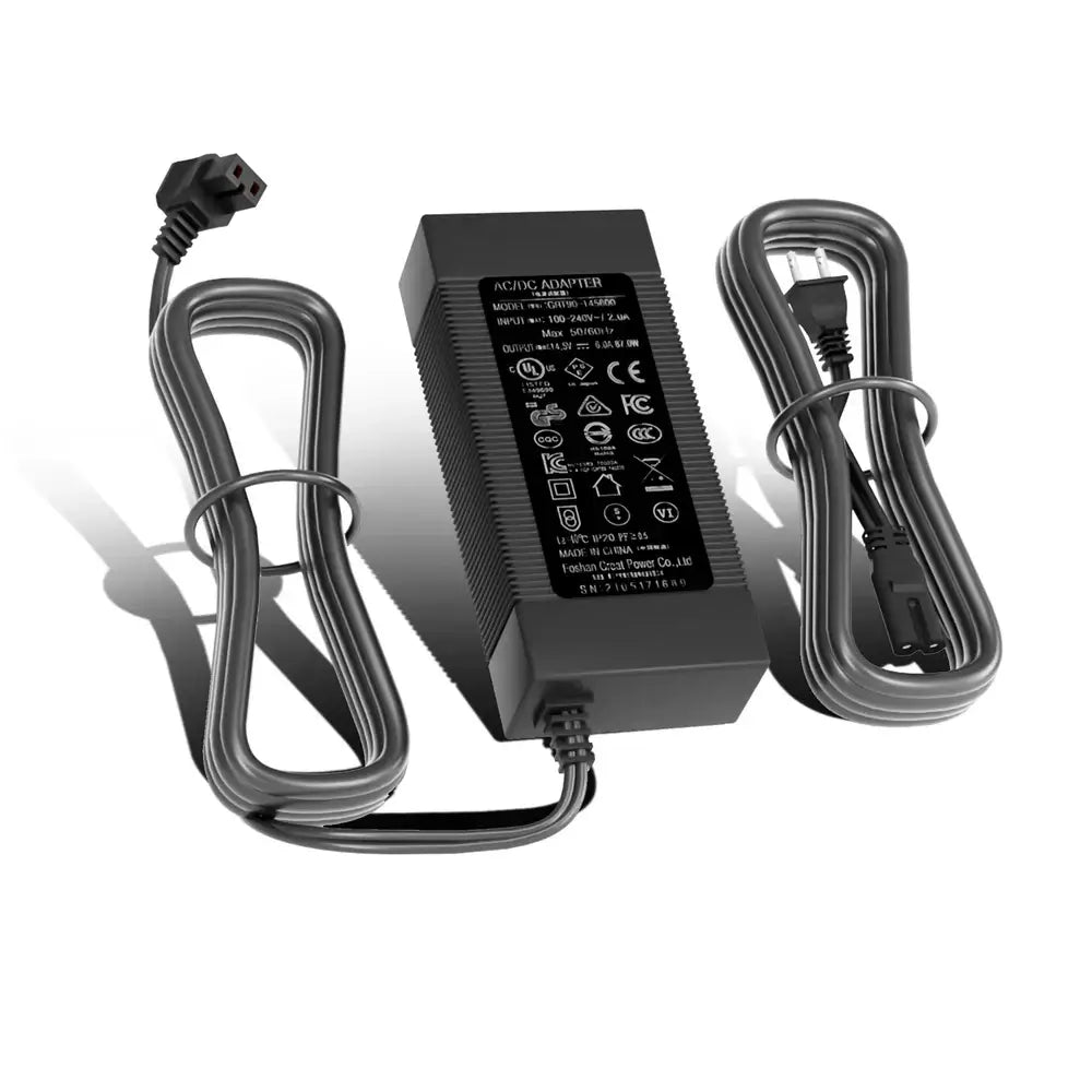 A rectangular black ACOPOWER Fridge power adapter with a label showing technical specs, plus two coiled power cords with plugs on both ends, all displayed on a white background.