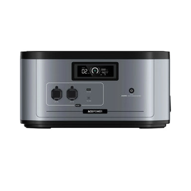 The ACOPOWER portable power station features a digital display, multiple output ports, and a front power button. This silver device with black accents is ideal for off-grid battery needs and is shown against a plain white background.