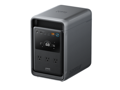 A gray Anker portable power station with a digital display, multiple ports, and three electrical outlets on the front panel. The side of the unit features the labels “Anker SOLIX” and “S2000,” shown against a white background.