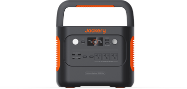 The Jackery portable power station features a digital display and multiple outlets, including AC, USB, and DC ports. Its black design includes orange accents and an integrated top handle for easy carrying.