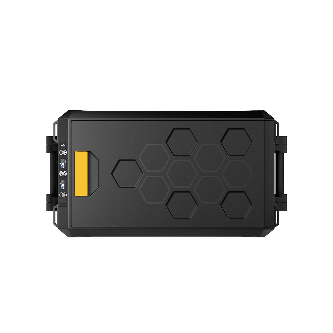 A rectangular black device from BougeRV, featuring a series of hexagonal patterns on the top surface, is depicted. It resembles a portable refrigerator with handles on both sides and a small yellow tab on the upper left corner. Several ports and buttons along one side suggest its IceDrive™ system capabilities.