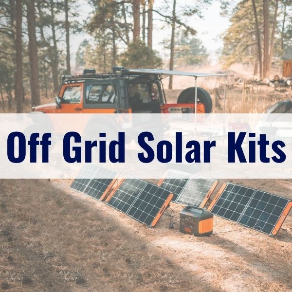 An outdoor scene showcasing an off-grid solar kit. Solar panels are set up on the ground in front of an orange SUV with an extended awning. The background features a forested area with tall trees. Text overlay reads "Off Grid Solar Kits.