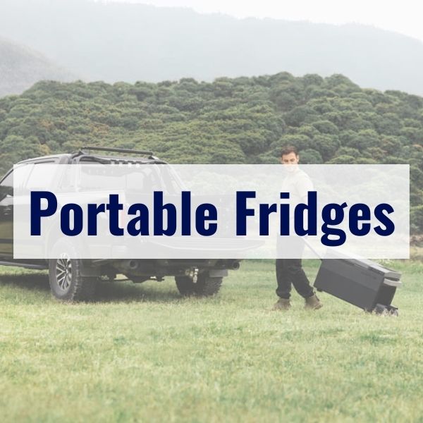 A person in an outdoor setting stands next to a vehicle while pulling a portable fridge with a handle. The words "Portable Fridges" are overlaid on the image in bold text. Trees and hills are in the background.