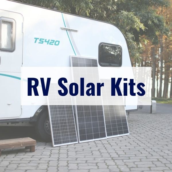 A recreational vehicle (RV) is parked on a paved surface with two large solar panels propped against its side. The text "RV Solar Kits" is prominently displayed over the image.