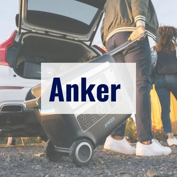 A person is pulling a portable power station on wheels from the trunk of a car. The brand "Anker" is prominently displayed on the image. Another person stands nearby, partially visible.