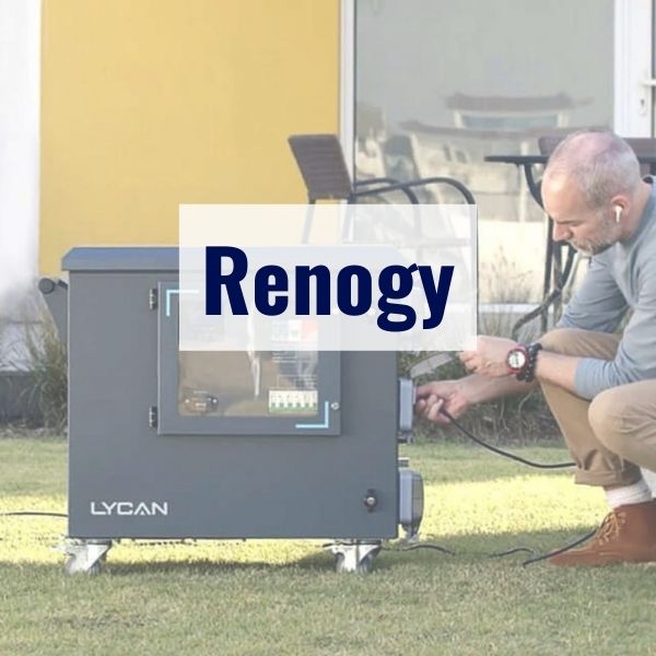 A man is kneeling on grass, connecting cables to a grey Renogy Lycan power box. He appears to be setting up or maintaining the device. The expression "Renogy" is prominently displayed on the image.