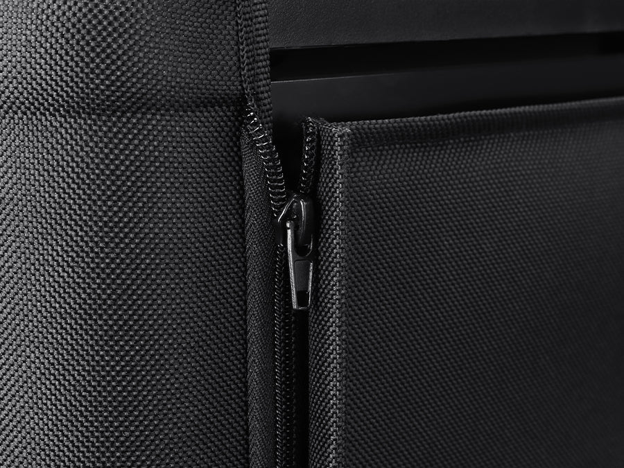 Close-up of a black fabric backpack, featuring a partially open zipper on the front pocket. The texture and design details, such as the precise stitching, are evident, similar to the meticulous craftsmanship seen in an ICECO Wholesale VL45 Pro portable freezer cover.