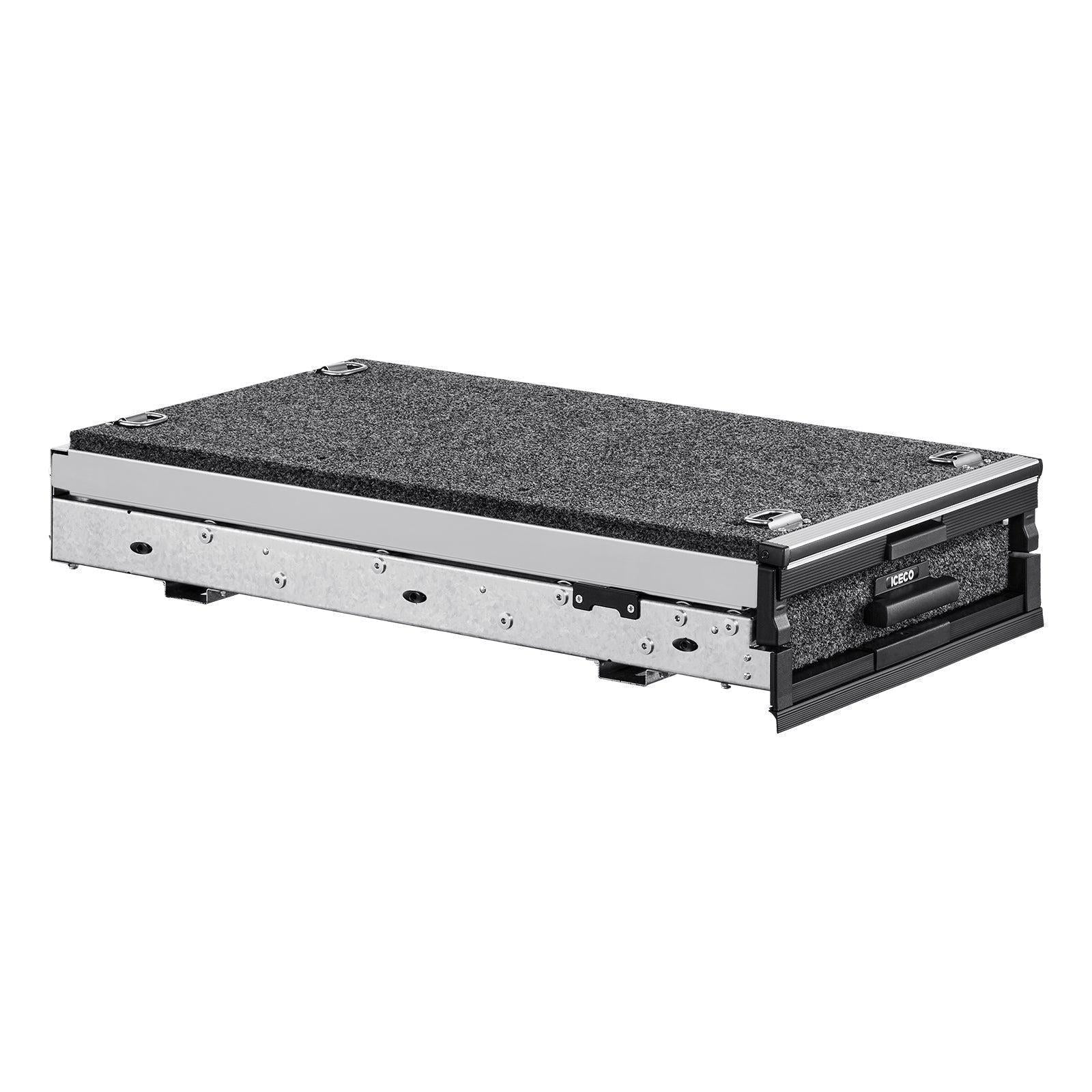 The ICECO Wholesale DS15 Roller Drawer System is a rectangular, gray carpet-covered platform with metallic edges, designed as an innovative roll-out drawer or storage unit, lying flat on a white background. It features several metallic components for seamless functionality.