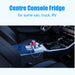 Interior view of a vehicle with an ACOPOWER center console fridge offering smart app control. A can of Coke stays cool alongside two smartphones plugged into charging cables. The text above reads, "Center Console Fridge for van, truck, RV.
