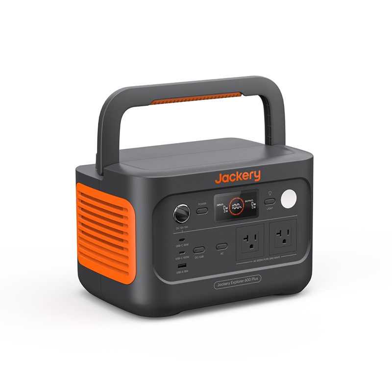 The Jackery portable power station features a handle, digital screen, two AC outlets, USB ports, and a DC input. It boasts a sleek black design with orange accents.