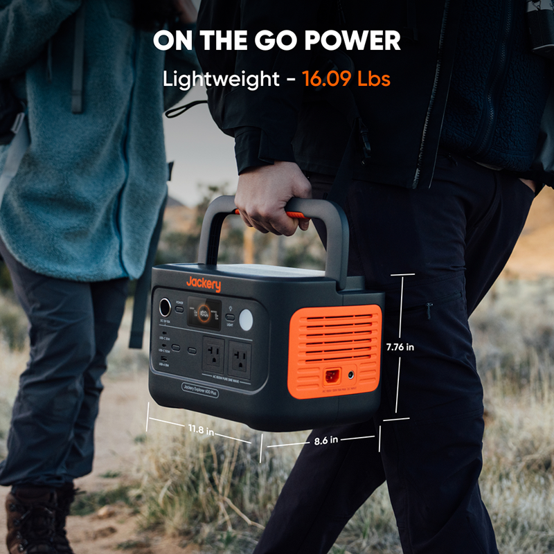 A hiker and their companion embark on an adventure with a Jackery Explorer 600 Plus portable power station, weighing only 16.09 lbs and sized at 11.8 x 8.6 x 7.7 inches, offering excellent outdoor durability for their journey.