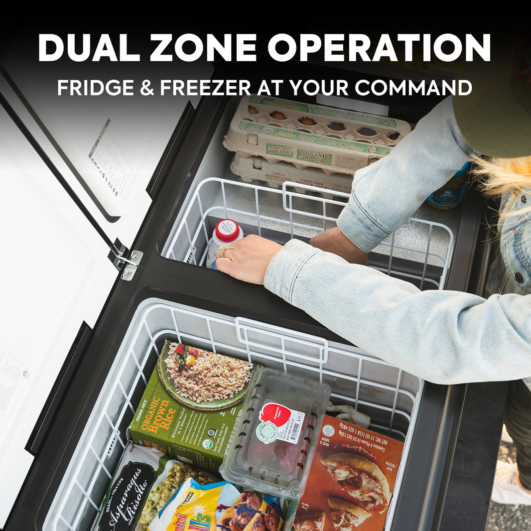 A person is placing a can inside a divided cooler filled with groceries like eggs, berries, and frozen meals. Text at the top reads "Dual Zone Operation: Fridge & Freezer At Your Command," featuring efficient cooling performance powered by an ICECO Wholesale Secop compressor.