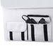 A white fabric organizer from ICECO Wholesale, adorned with black accents and multiple pockets, is perfect for storing accessories for your ICECO APL35 Portable Refrigerator. It includes a pocket with a coiled black cable and "Iceco" plug, another pocket with a flap, against a white surface background.