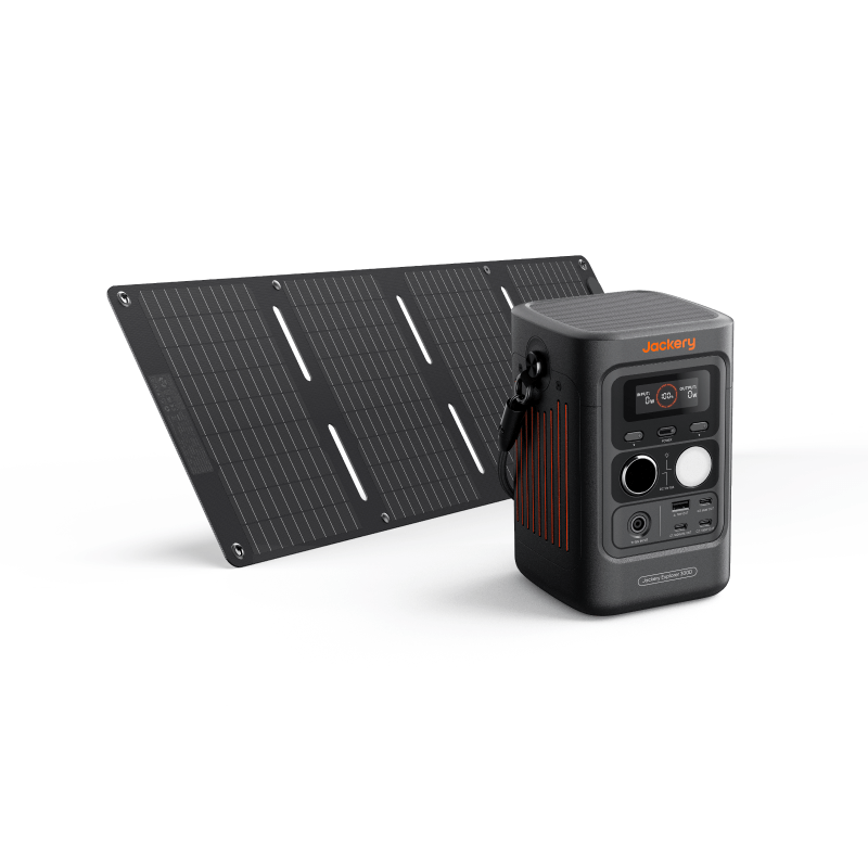 A Jackery portable power station with built-in charging and multiple ports stands before a foldable solar panel. Both have compact black designs with orange accents and are set against a white background.