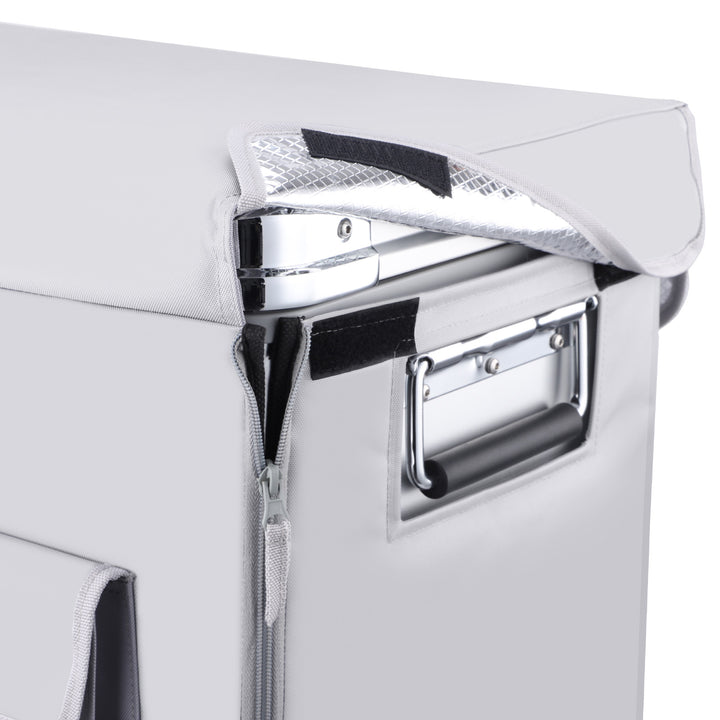 A close-up of a gray camping cooler highlights reflective insulation and thermal protection, featuring side metal handles and a slightly opened insulated cover, resembling the interior design of the ICECO Wholesale APL35 Portable Refrigerator.