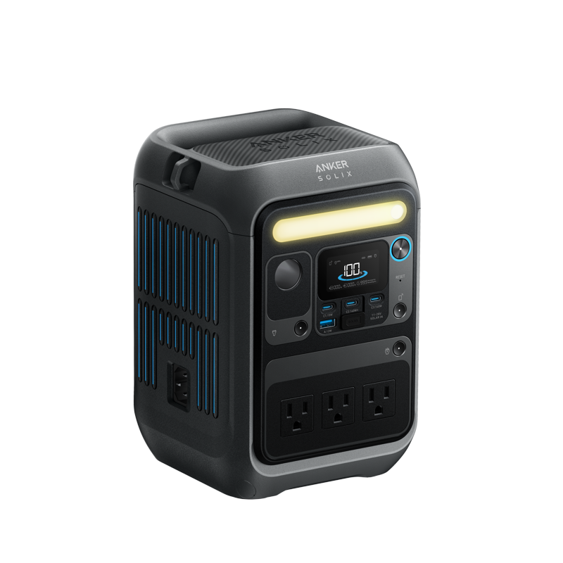 Anker's portable power station features a black and gray design, digital display, control buttons, three AC outlets, multiple ports, and a horizontal front light strip. Blue side accents give it a modern look.