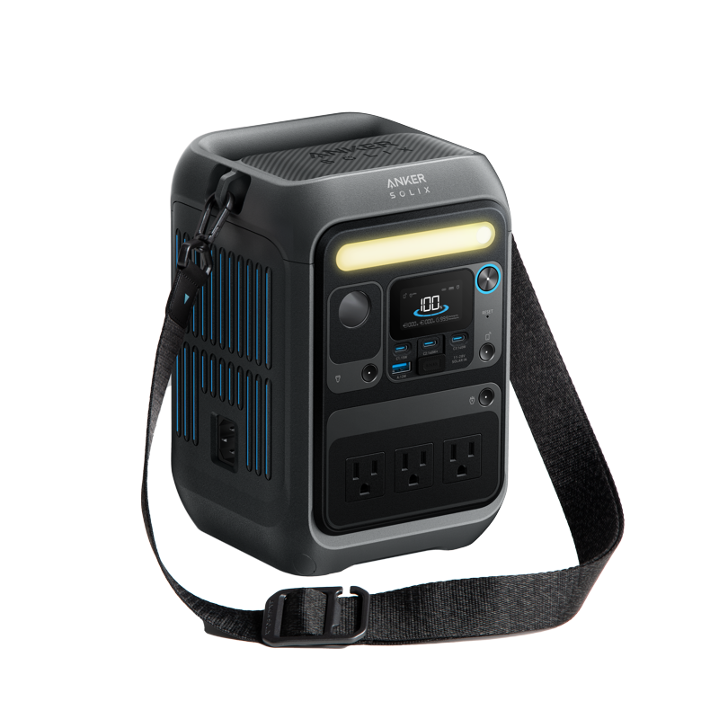 The Anker portable power station features a carrying strap, three AC outlets, multiple USB ports, LED light strip, digital display screen, and ventilation grills—delivering reliable power wherever you go.