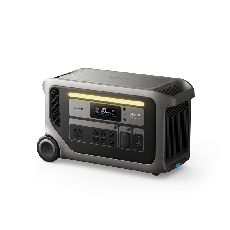 The Anker Solix F3000 portable power station has a display screen, multiple outlets, control buttons, vents, and a wheeled handle for easy transport—perfect for reliable backup power. Photographed on a white background.