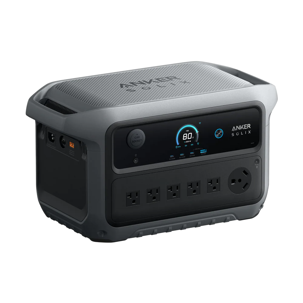 An Anker Solix portable power station in gray features a digital display, six AC outlets, a circular outlet, and multiple side ports, all set against a plain white background.