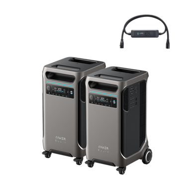 Displayed above are two Anker SOLIX F3800 portable power stations, celebrated for their sleek design and equipped with wheels for easy movement and prominent control panels. Portability is further enhanced by handles on top. Accompanying them is an accessory with a short cable, integrating seamlessly with this dual power hub system.