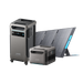 Two Anker SOLIX F3800 power stations equipped with digital displays are set next to a foldable solar panel. The taller, mobile power station features wheels for easy transportation, while the solar panel is angled for optimal energy absorption.