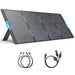 The Anker portable solar panel, part of the SOLIX PS400 series, features four segments and two distinctive blue handles. It is easily supported by a sturdy stand for convenient positioning. Below the panel are two sets of connecting cables equipped with various plug types, designed to maximize solar power conversion efficiency during travel or outdoor use.