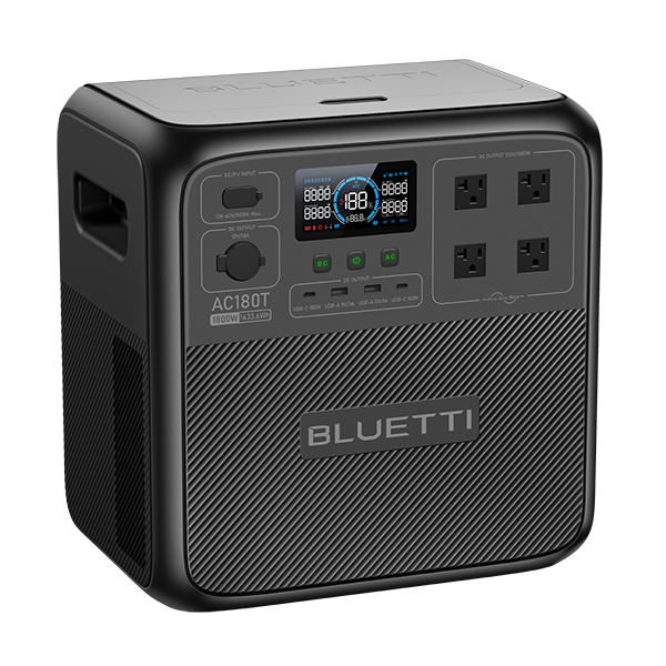 A compact Bluetti portable power station featuring four AC outlets, an LCD screen for real-time power information, and multiple input/output ports on the front panel. The unit is finished in black with a subtle textured surface and prominent Bluetti branding.