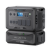 Two stacked black Bluetti portable power stations are shown. The top unit, labeled “AC500 5000W,” features a display screen and multiple outlets, while the bottom unit is marked “B300S 2764.8Wh.” Both have handles and side vents.