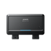 A black Anker device with a rectangular design, featuring a front-facing button and two ports at the bottom, is photographed against a plain white background.