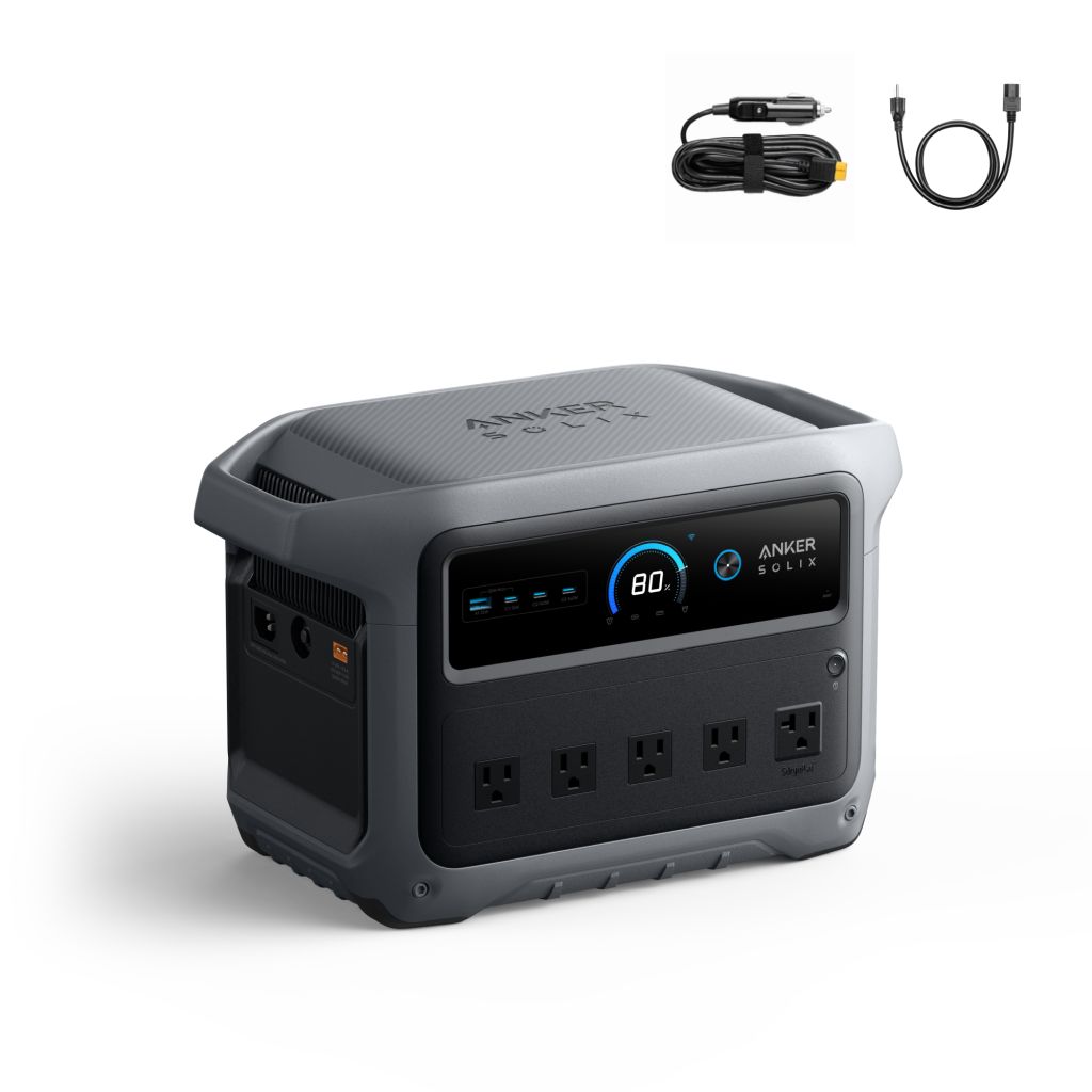 Anker portable power station with a display screen, four AC outlets, six USB ports, and Anker logo on the front. Above it are two cables: one car adapter and one standard charging cable.
