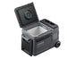 A portable rectangular Anker electric cooler with a hinged lid open, showing an empty interior. It includes a digital display, side handle, wheels, and an inside-lid vent.