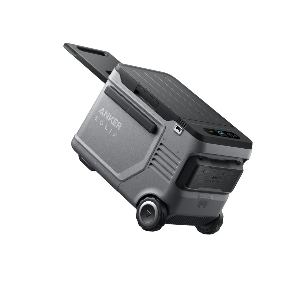 The Anker Solix portable power station, shown in gray with wheels and a retractable handle, is tilted to display its mobility—perfect for powering your electric or solar cooler wherever you go.