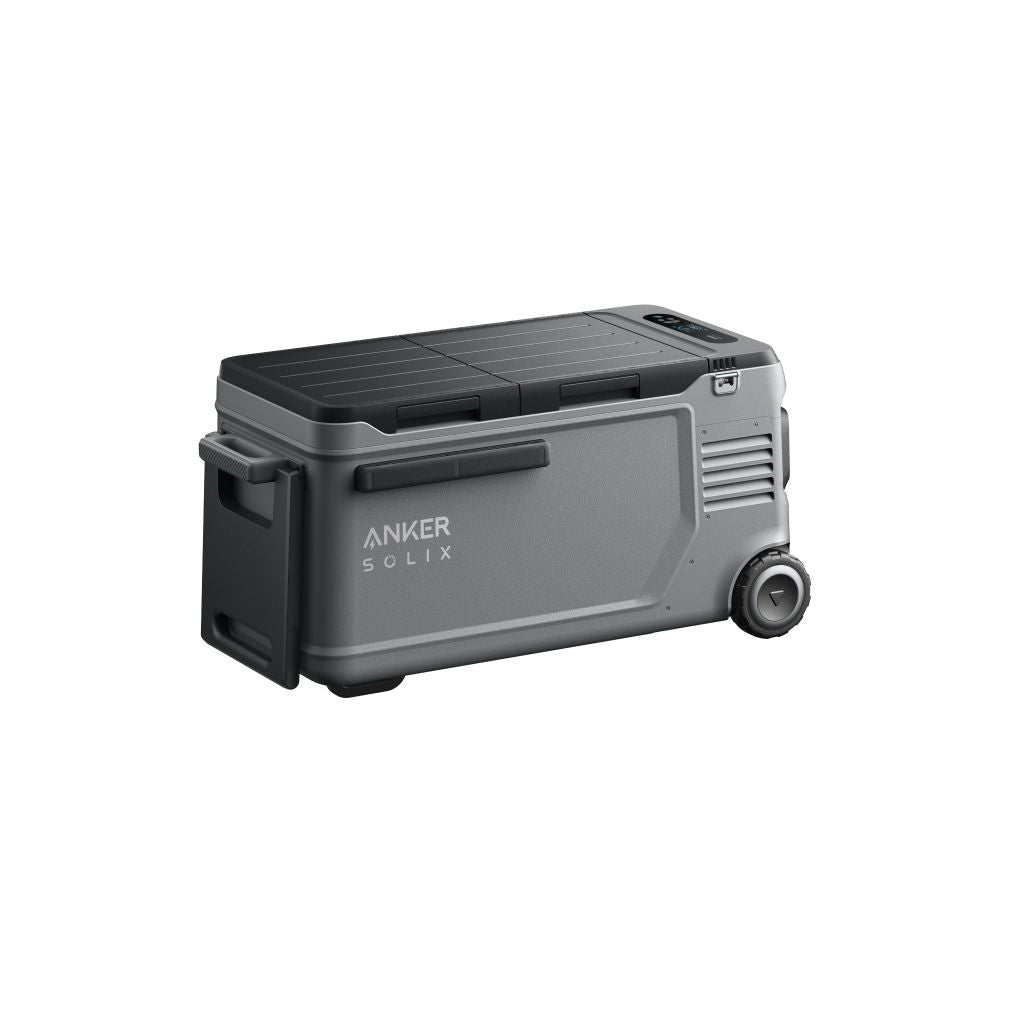A portable gray and black Anker cooler with wheels and a handle, labeled "Anker Solix," features smooth sides, a vent, and a grooved lid for easy gripping.
