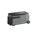A portable gray and black Anker cooler with wheels and a handle, labeled "Anker Solix," features smooth sides, a vent, and a grooved lid for easy gripping.