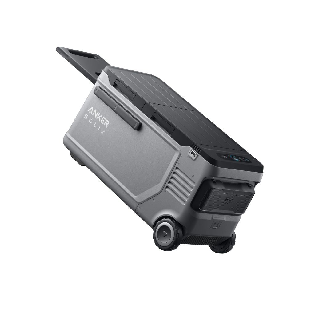 Anker Solix is a portable power device with wheels, a handle, and a digital display, resembling a gray suitcase. Designed by Anker for mobility and outdoor use.