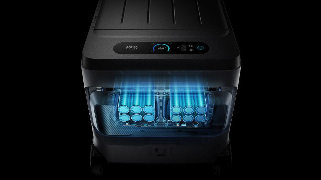 Anker SOLIX EverFrost 2 Electric Cooler 40L (42 QT) by Anker, viewed from above, shows cans lit by blue light inside. The digital display reads -20°C, indicating the portable fridge’s electric cooling is active with its 288Wh battery.