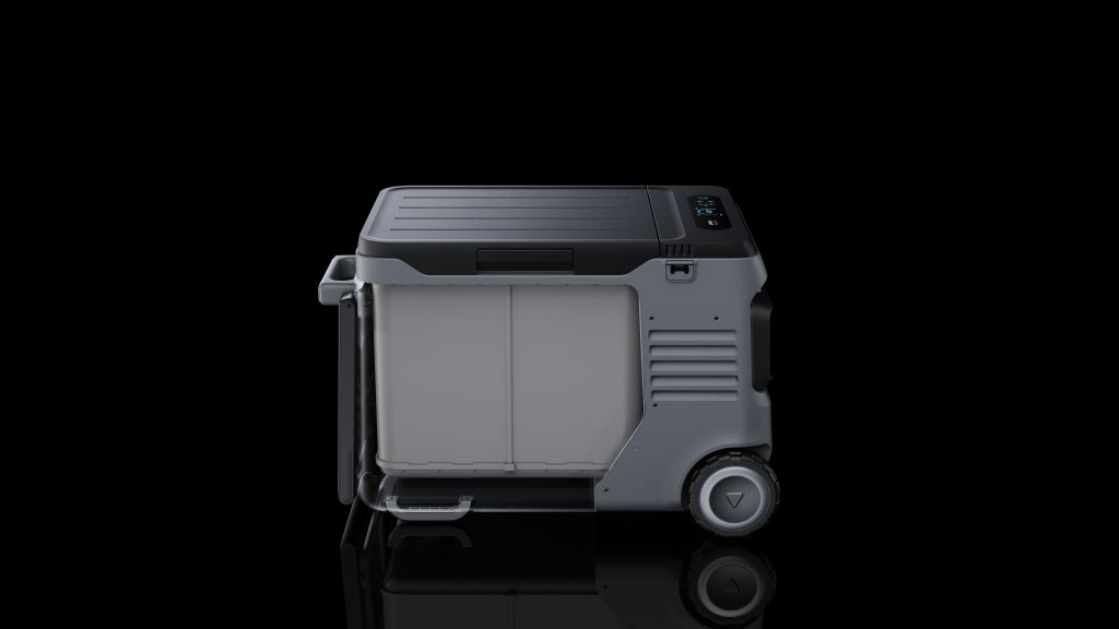 An Anker gray, box-shaped electric cooler with wheels and a digital display on the top right corner, shown against a black background.