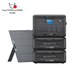 A Bluetti AC500 portable power station featuring a touchscreen, paired with two B300K expansion batteries and a solar panel, includes free adapters—making it an ideal solution for backup or on-the-go power needs.