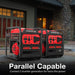 Two PowerSmart red and black portable generators are side by side on a driveway. Text reads: "Parallel Capable—connect two quiet PowerSmart generators for double the power.