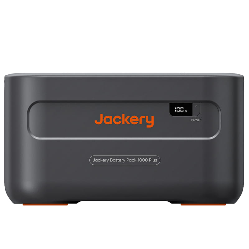 The image showcases the Jackery Battery Pack 1000 Plus, a versatile portable power solution with a dark gray rectangular body featuring the Jackery logo and an LED screen displaying 100% charge level, highlighting its solar charging capability.