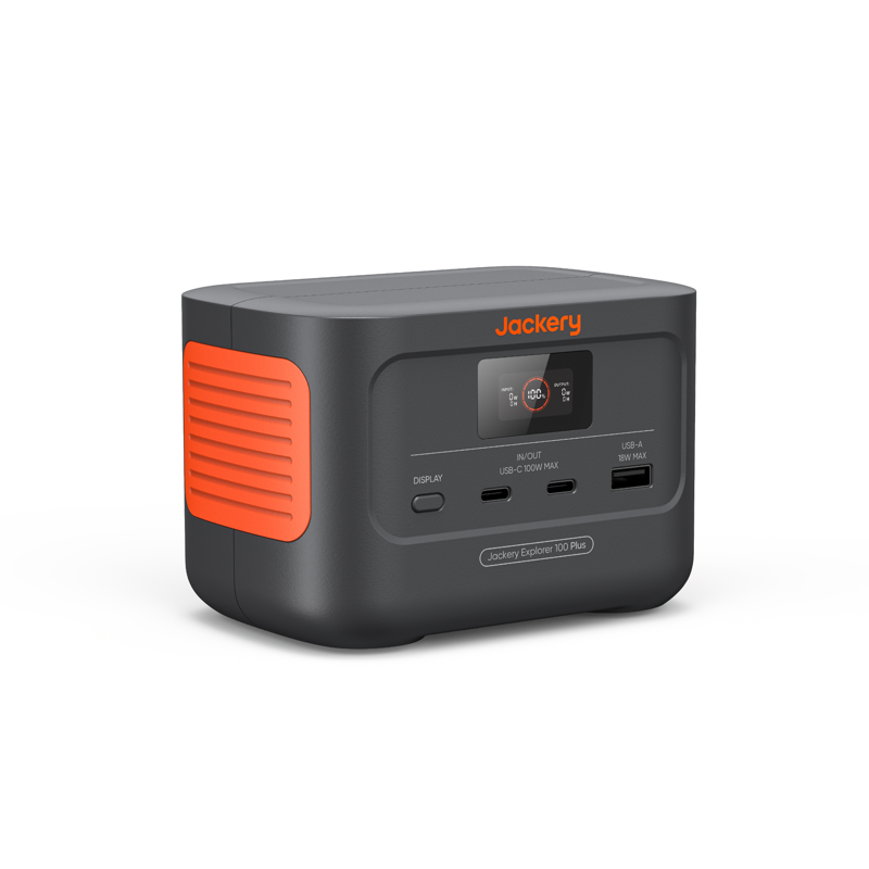 A black Jackery portable power station with orange accents, featuring a digital display and multiple input/output ports.