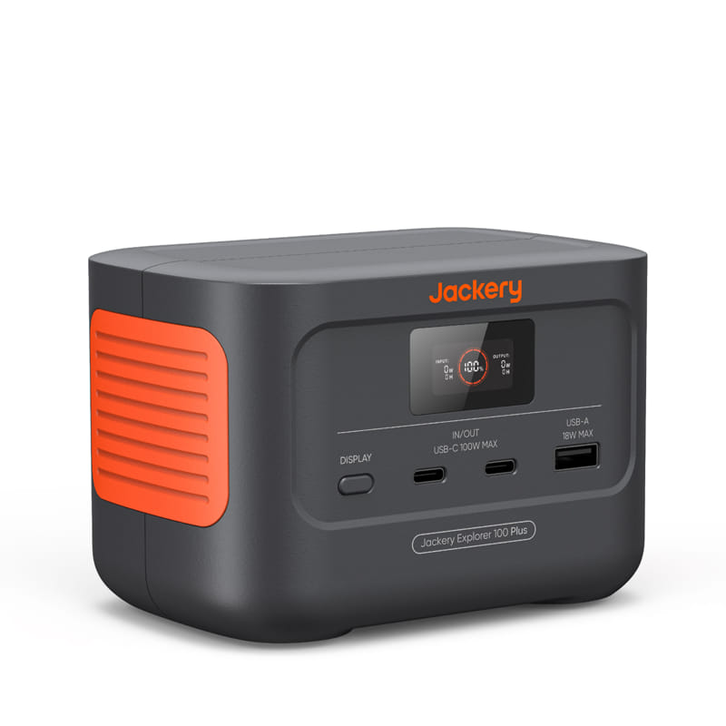 A Jackery portable power station features a dark gray body with orange accents, and a front panel with a display screen. It includes USB-C and USB-A ports, displaying the brand "Jackery" and is labeled "Jackery Explorer 1000 Plus.