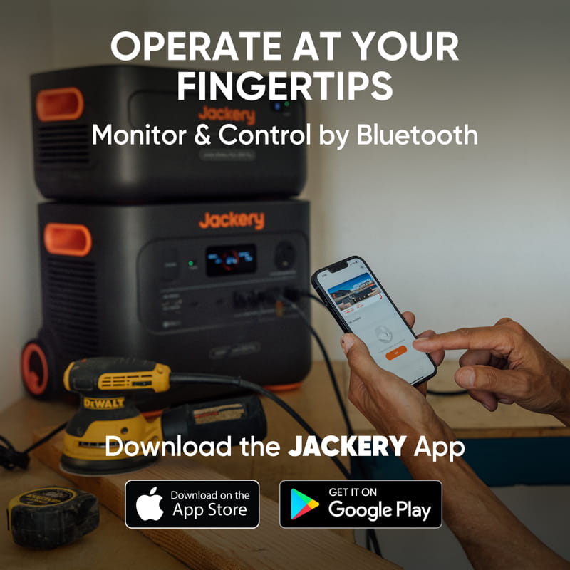 A person uses a smartphone app to control a Jackery power station, stacked with another labeled Jackery device, in a room. Text reads: "Operate at Your Fingertips. Monitor & Control via Bluetooth.