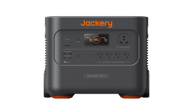 The image displays a Jackery portable power station featuring multiple outlets, such as standard AC outlets and a large circular plug. It is dark gray with orange accents, topped with the Jackery logo.