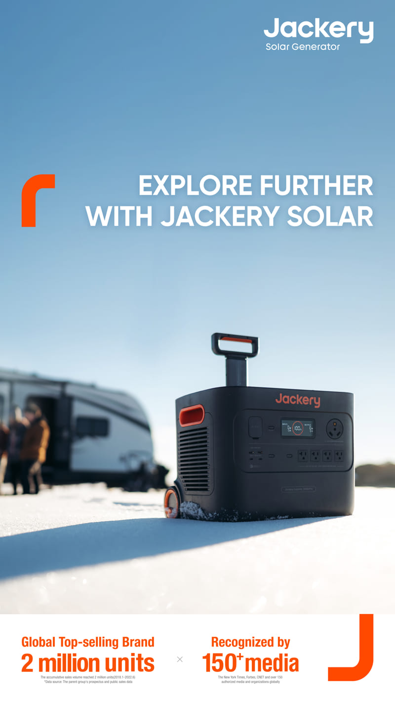 The image features a high-capacity Jackery Solar Generator set in a snowy outdoor scene, prominently displaying the text "Explore Further with Jackery Solar." It highlights global sales achievements and media recognition. A trailer is seen in the background, emphasizing the generator's portable design.