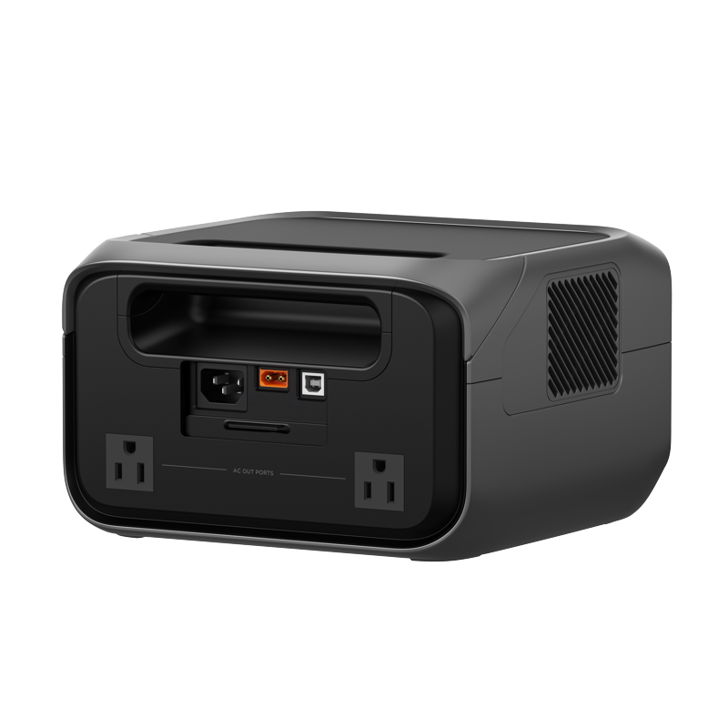 A black EcoFlow device featuring two AC outlets, a power switch, an input port, and a USB port on the back panel. It has ventilated sides and a flat, slightly recessed top surface.