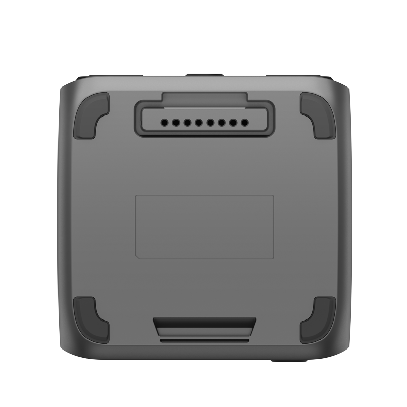 The image displays the underside of a compact, rectangular EcoFlow electronic device with rounded edges. It appears to be a battery or charging dock, featuring central connector pins and small rubber pads at each corner.