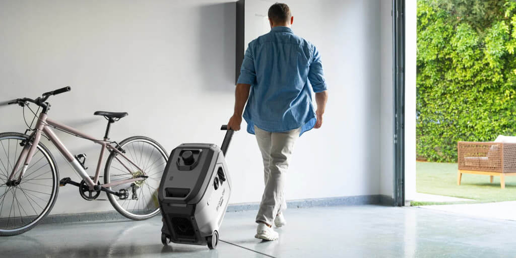 Person moving EcoFlow Dual Fuel Smart Generator 4000 in a spacious garage with a bicycle